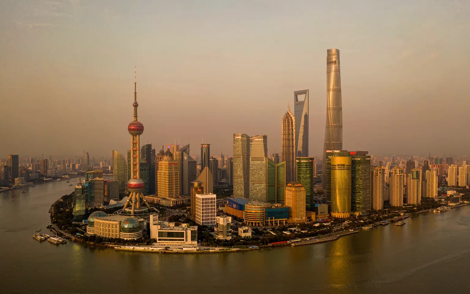 Shanghai skyline across the Huangpu River at dusk
